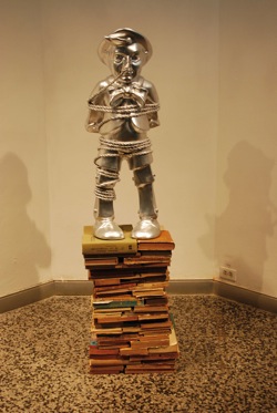 Esterio Seguras chromed fiberglass sculpture, "Pinocchio with Rope"